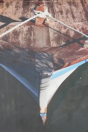Foto impresa sobre taco de madera con una barca